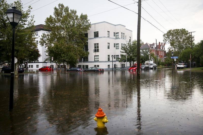 Gradyon Avenue at Blow Street is flooded following heavy rainfall in the Ghent neighborhood of Norfolk on Aug. 11, 2020. (Kristen Zeis/The Virginian-Pilot)