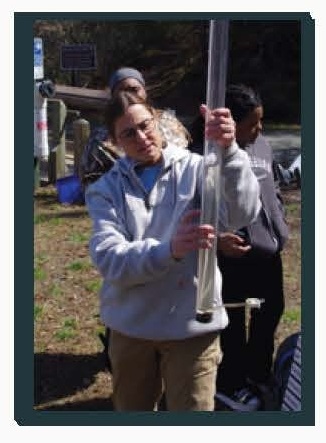 Photo of student using a large water test tube